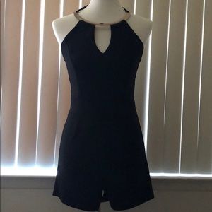Beautiful black romper with silver neckline